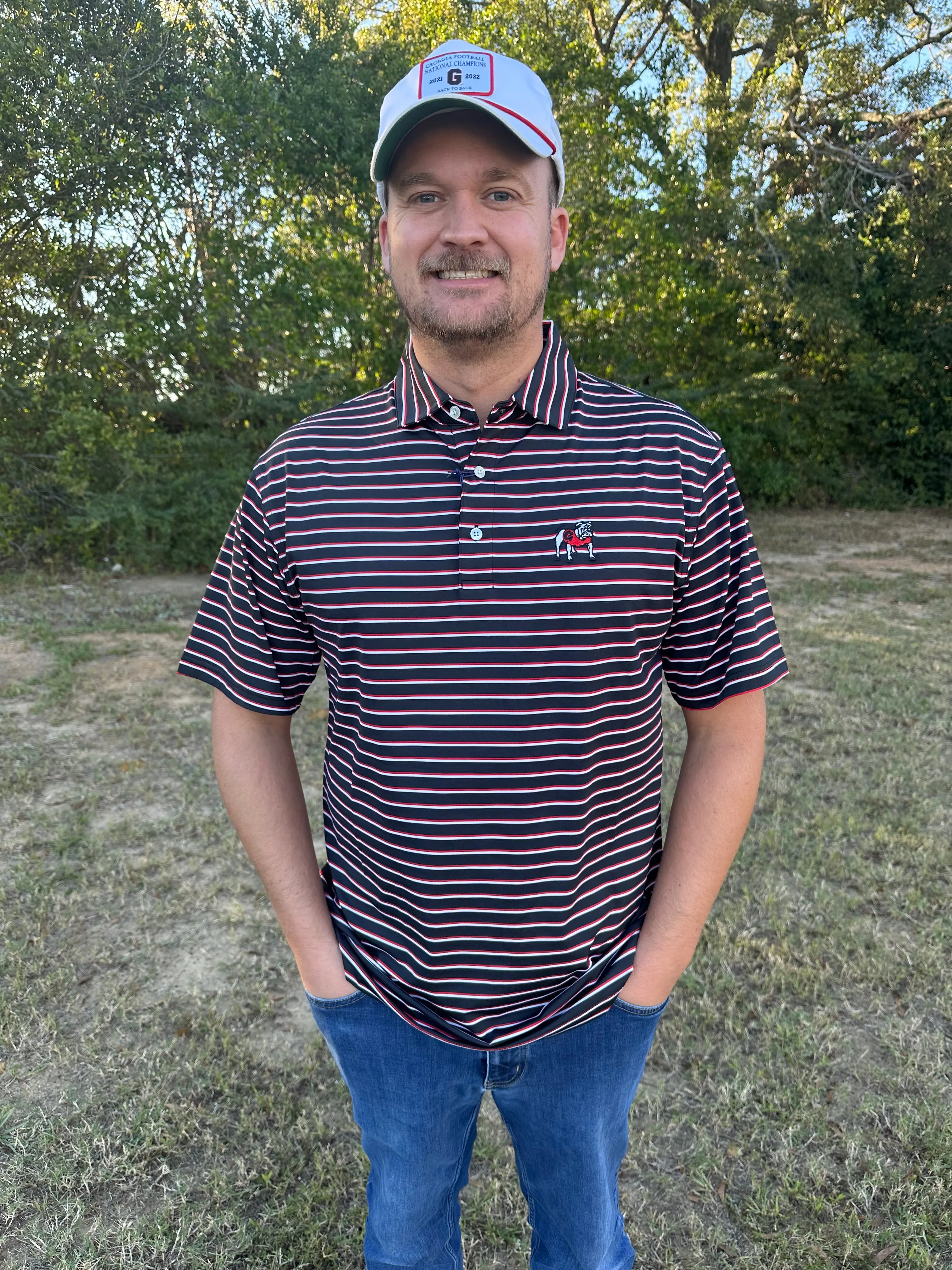 Onward Reserve UGA Fairway Stripe Standing Bulldog Performance Polo - Black