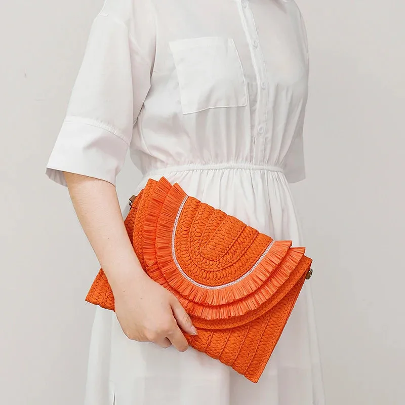 SOLEI WOVEN TASSEL CLUTCH